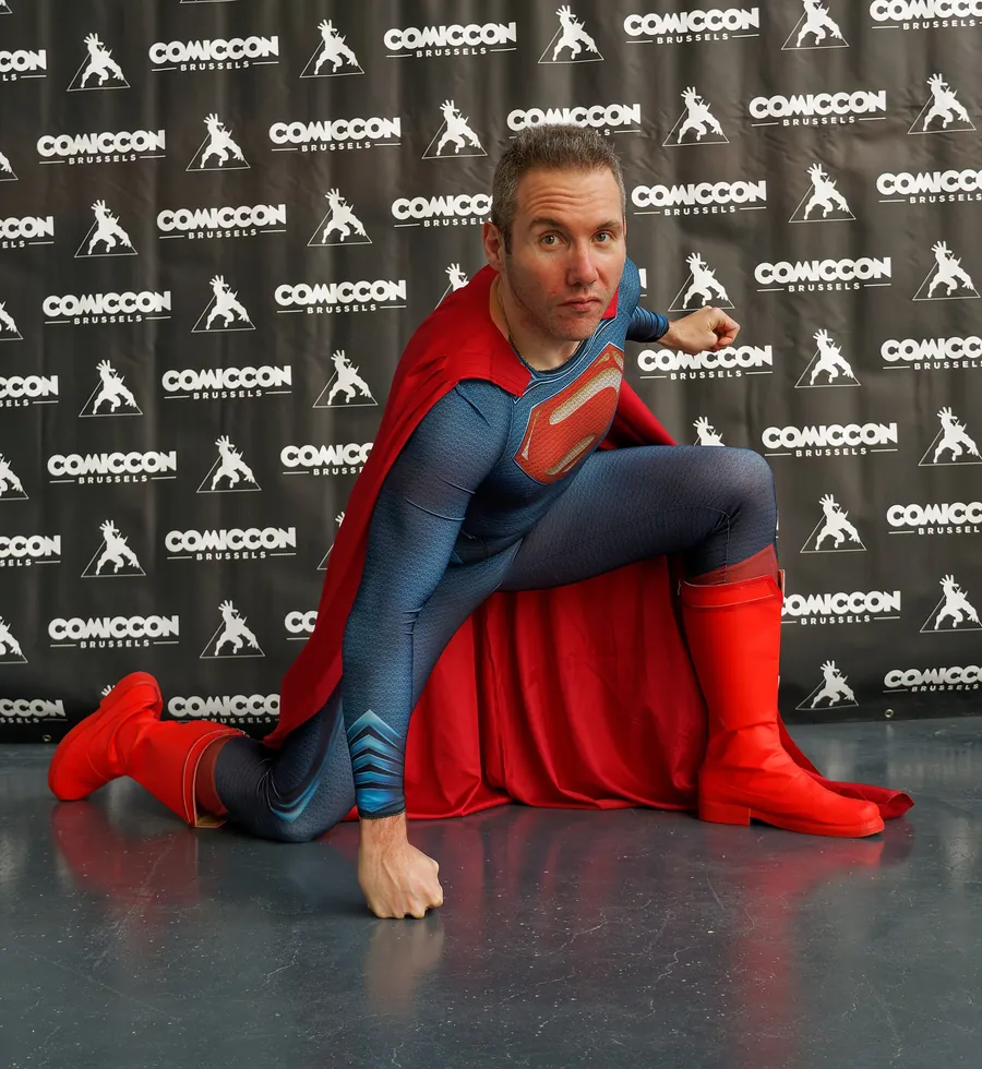 Superman in the classic blue suit with the red cape and yellow belt